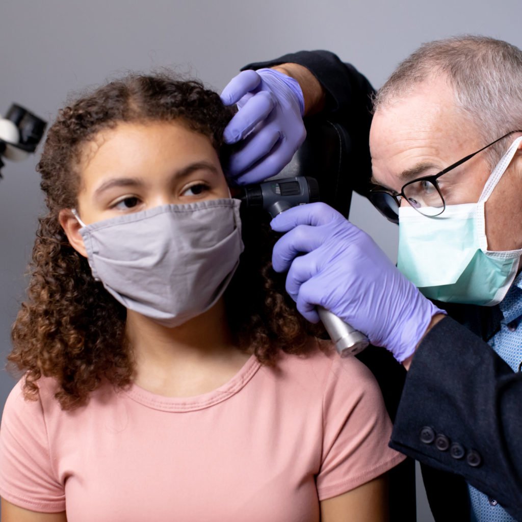 ENT Feature image: doctor examines child.