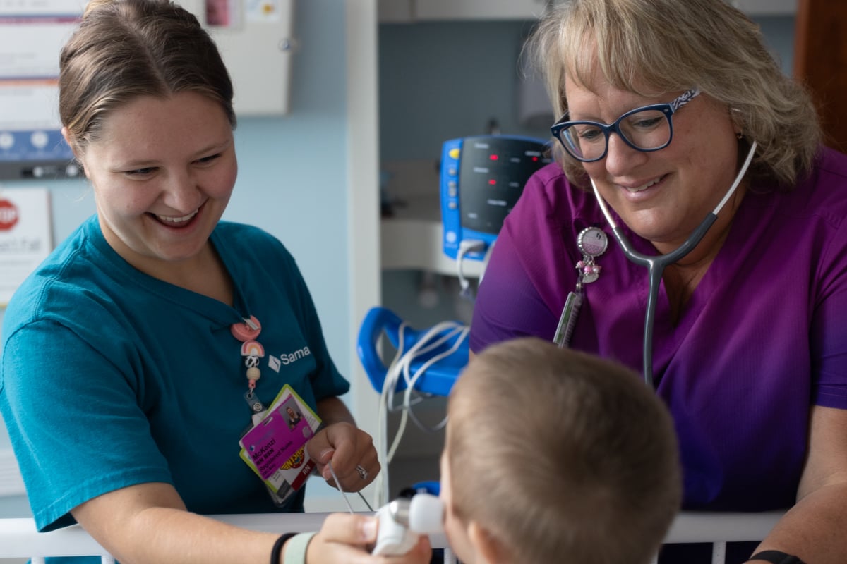 Patient care at Samaritan's Car-Freshner for Women and Children: pediatric unit. Nurses caring for peds patient.