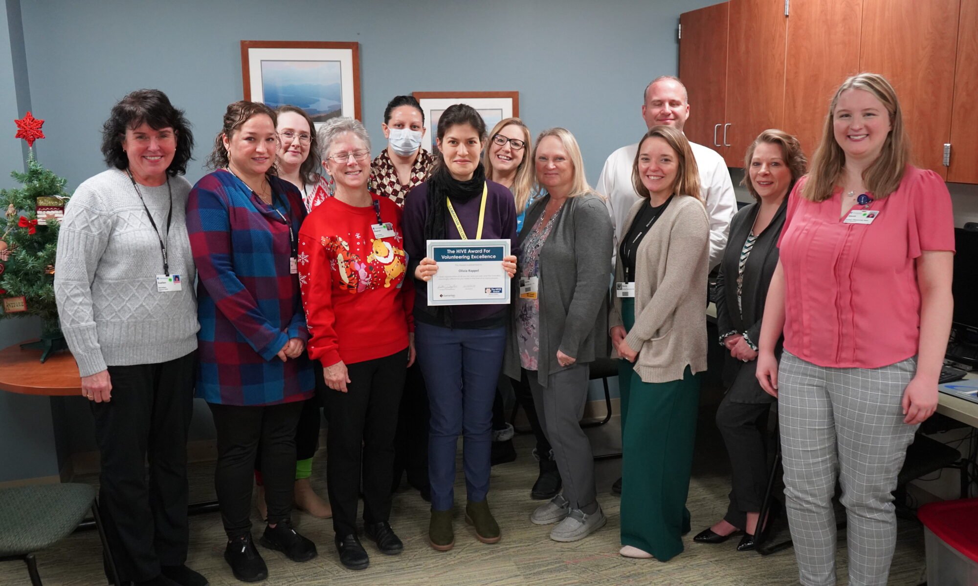 A group photo showing HIVE award winner Olivia Rappel and Samaritan staff members