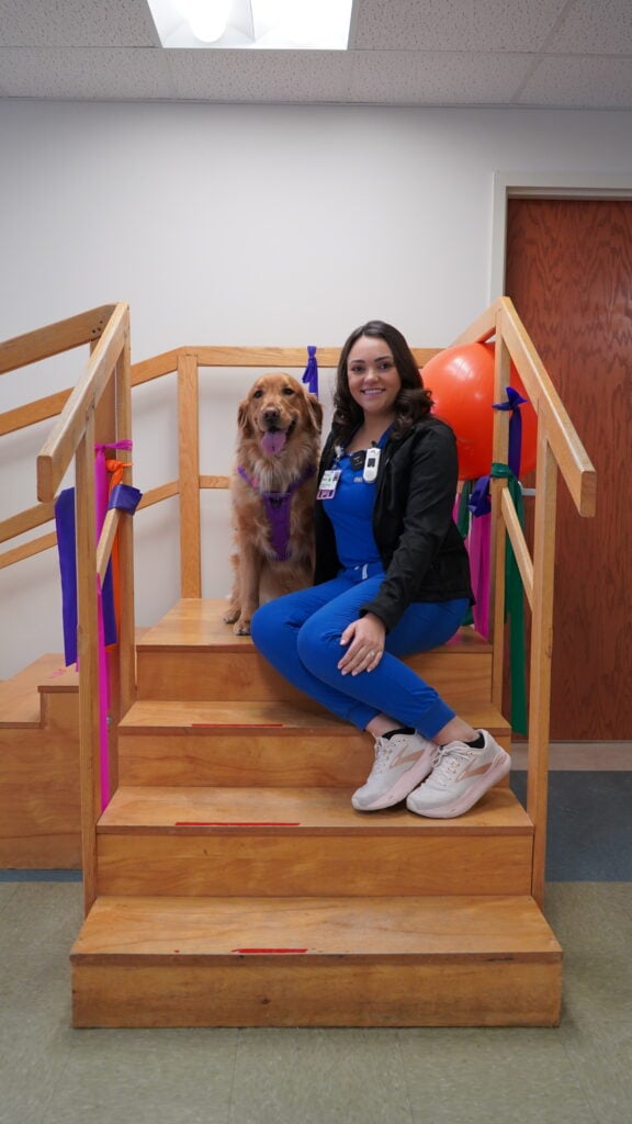 Photo of Charlie the Therapy Dog and Alexis Shippee, PT, DPT