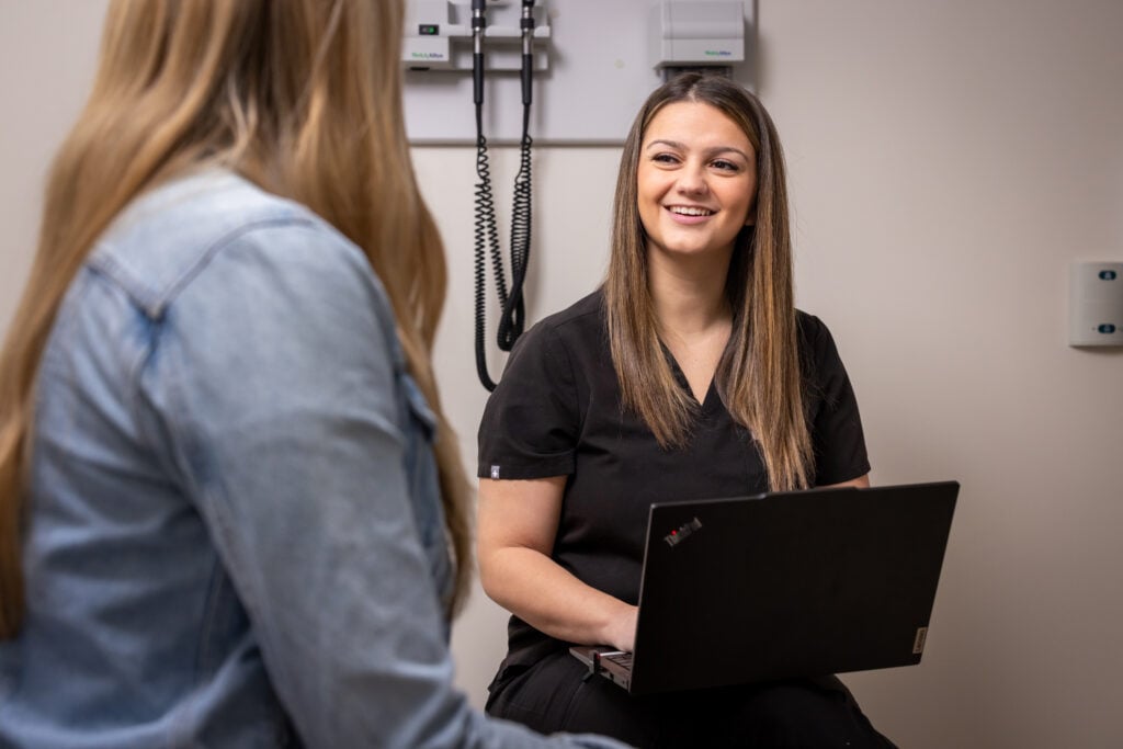 Medical Assistant helps a patient