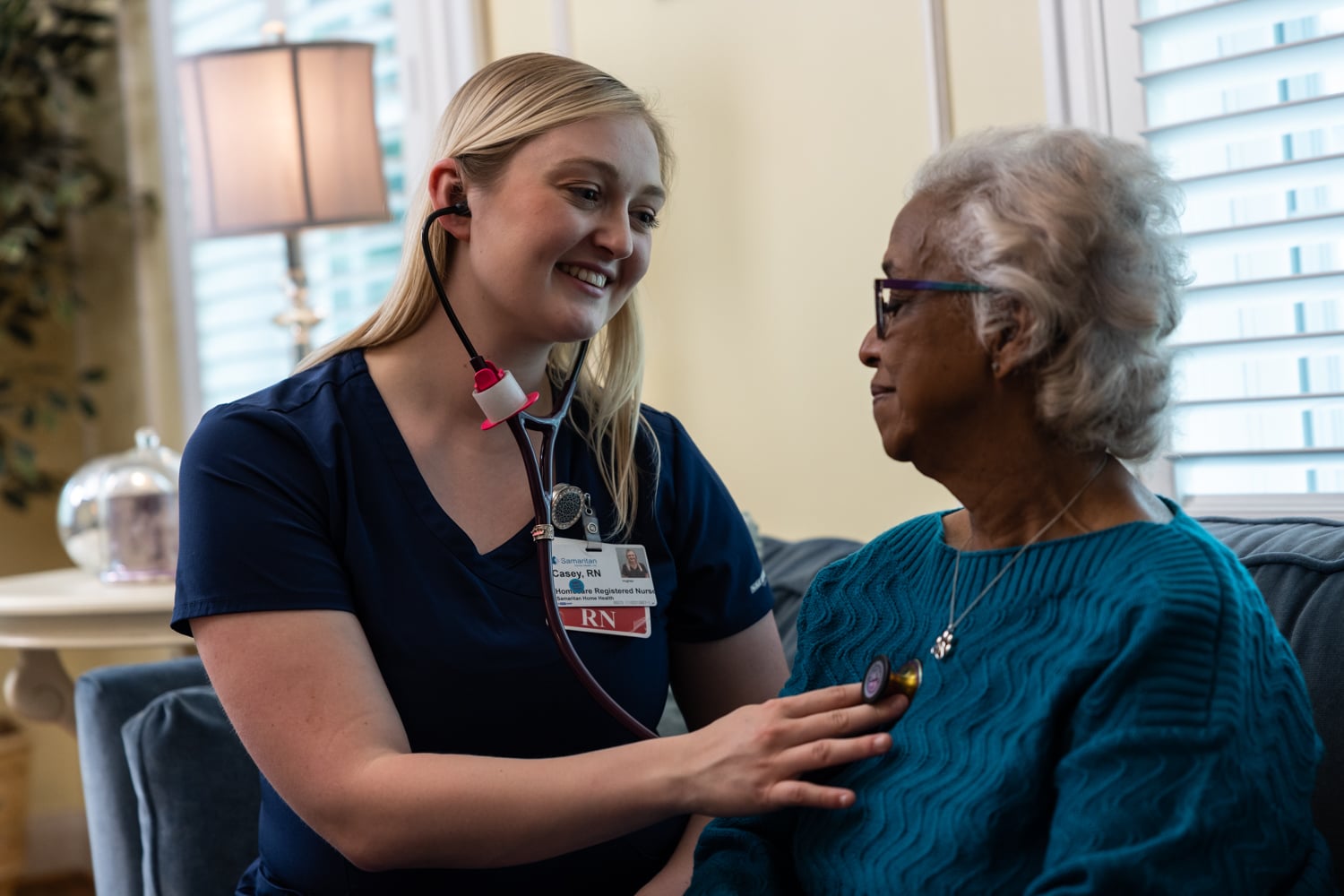 Photo of Home Health RN Casey seeing a patient