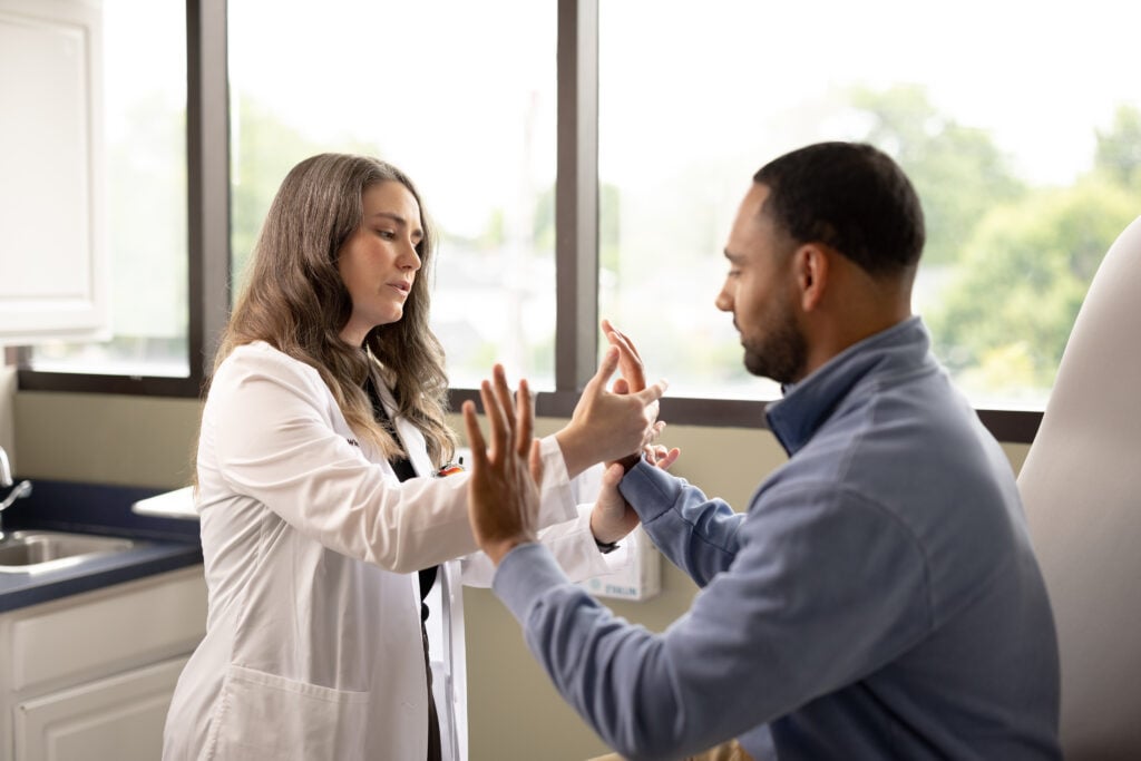 Photo of Caitlin Winkler, PA-C with a neurosurgery patient