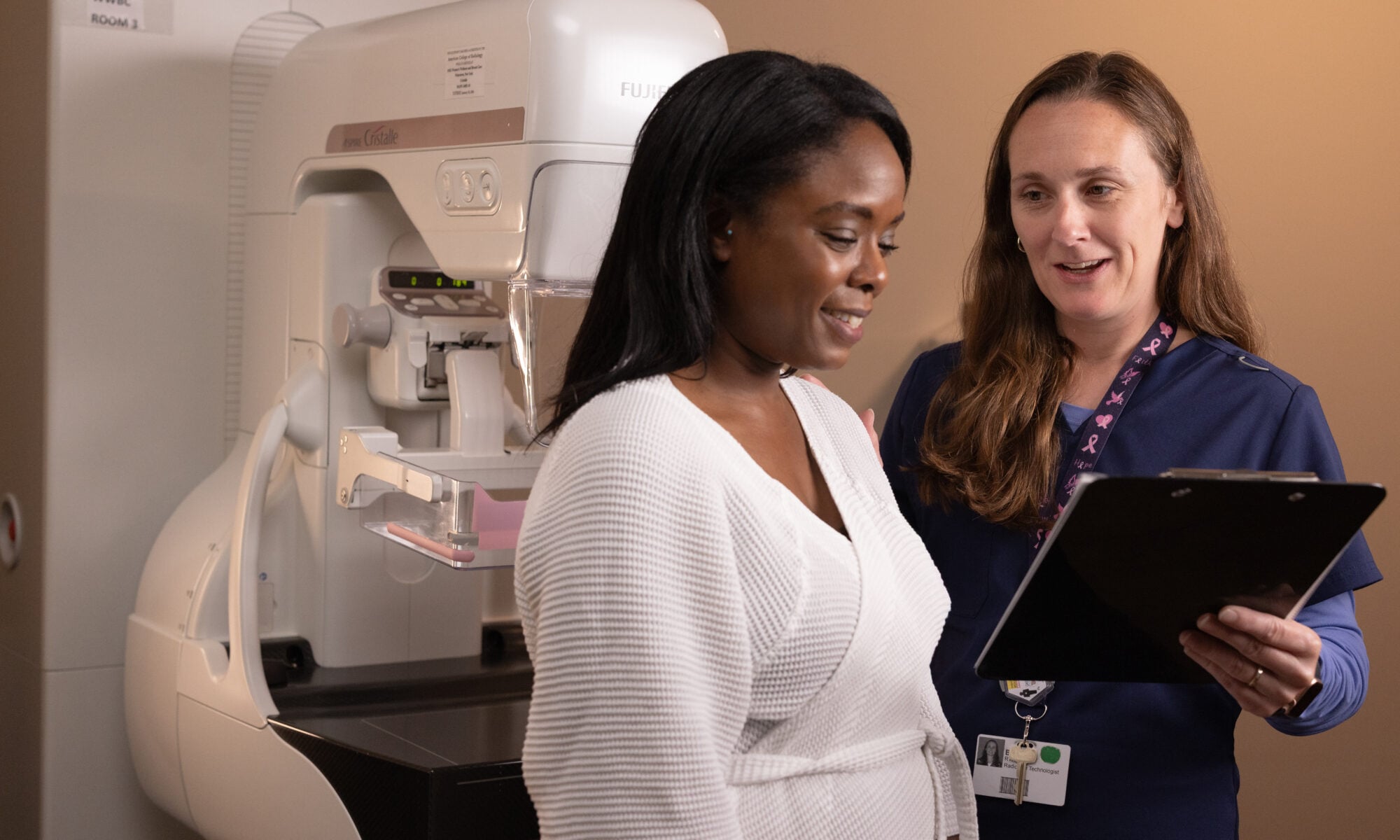 Photo of a tech with a mammogram patient at Women's Wellness and Breast Care