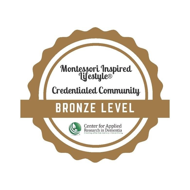 An award icon for Bronze Level Dementia Care