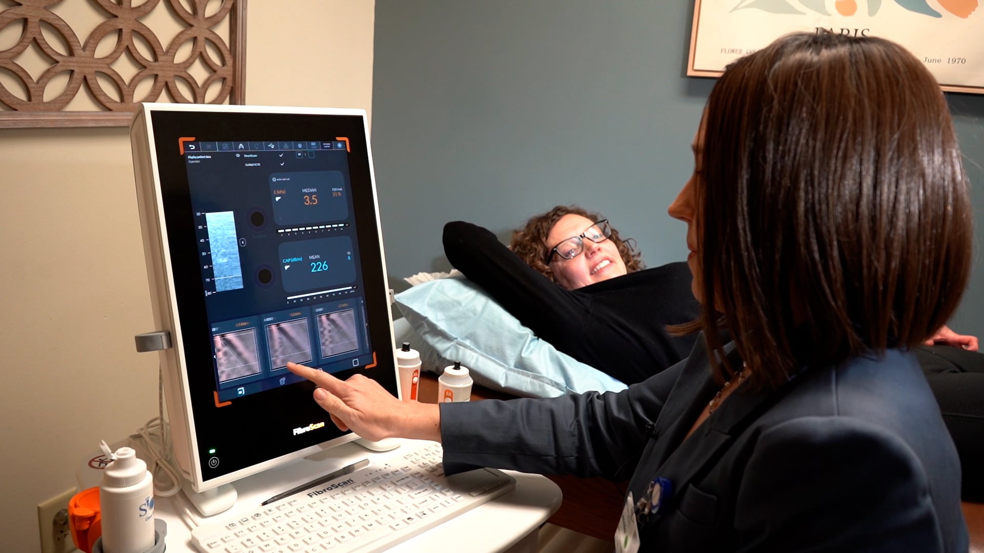 A patient gets results from a FibroScan