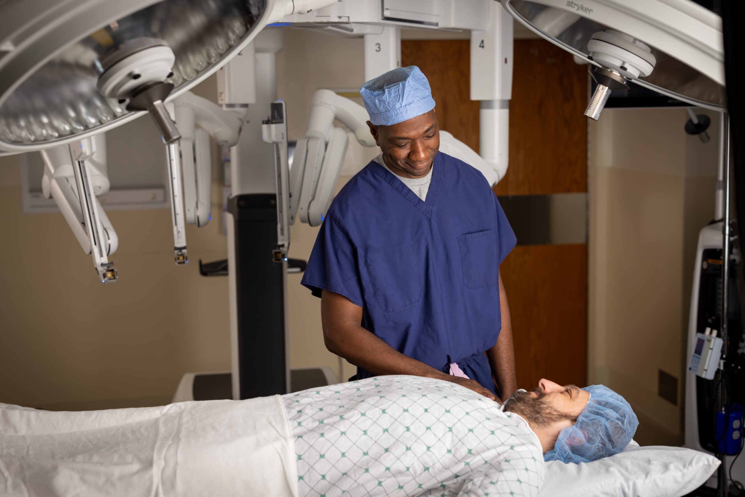 Dr. Chandler consults a patient before a urology procedure with the da vinci robot