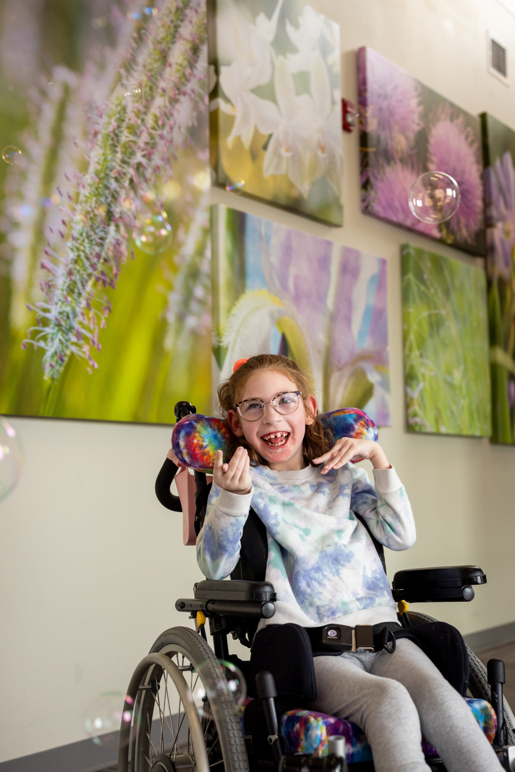 Charlie, CMN kid, smiles at bubbles