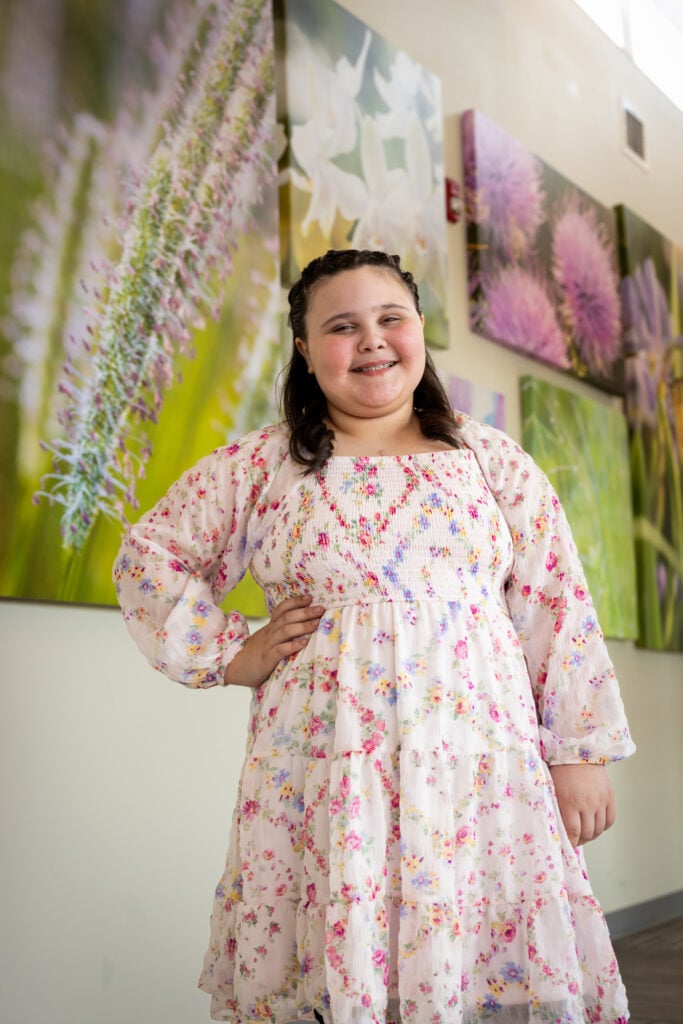 Olivia, CMN kid, poses for a photo